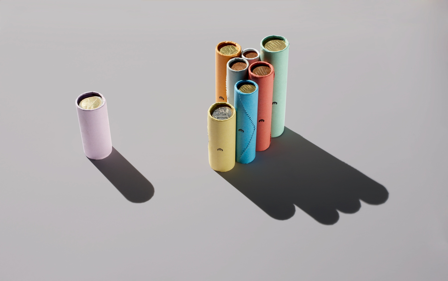 Colored rouleaux one standing out, currency union
